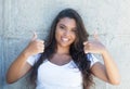 Latin american woman with long hair showing both thumbs up Royalty Free Stock Photo