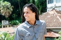 Latin american young adult man with dreadlocks looking sideways Royalty Free Stock Photo