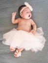 latina babe lying on a bed yawning in a pink ballet dress Royalty Free Stock Photo