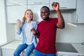 Latin brazilian male and redhaired ginger female movement at kitchen. move at new apartment ,morning lights Royalty Free Stock Photo