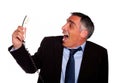 Latin business man laughing with a phone Royalty Free Stock Photo