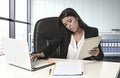 Latin business woman suffering stress working at office compute Royalty Free Stock Photo