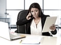Latin business woman suffering stress working at office computer desk worried Royalty Free Stock Photo