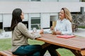 Latin business women middle age and colleagues eating salad at the office terrace in Mexico Latin America Royalty Free Stock Photo