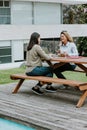 Latin business women middle age and colleagues eating salad at the office terrace in Mexico Latin America Royalty Free Stock Photo
