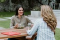 Latin business women middle age and colleagues eating salad at the office terrace in Mexico Latin America Royalty Free Stock Photo