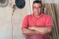 Carpenter posing at his workshop with his arms crossed Royalty Free Stock Photo