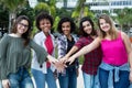 5 latin and caucasian and african american women keep together Royalty Free Stock Photo