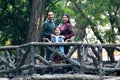 Latin couple session with 8 year old girl in public park with vegetation