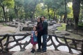 Latin couple session with 8 year old girl in public park with vegetation