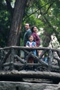 Latin couple session with 8 year old girl in public park with vegetation