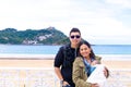 Latin couple and their baby on the beach in springtime Royalty Free Stock Photo
