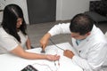 Latin doctor specialist neurologist performs a study of evoked potentials, diagnostic techniques with sensory stimuli and the reco