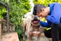 Latin dog and man showing their love for each other. Man& x27;s best friend. Tender and smiling Pitbull. Royalty Free Stock Photo