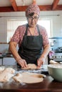 Latin Elderly Woman Crafting Flavorful Chilean Meat and Onion-filled Empanadas in her Countryside Home Kitchen