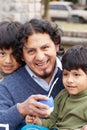 Latin family sitting in the street Royalty Free Stock Photo