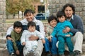 Latin family sitting in the street Royalty Free Stock Photo