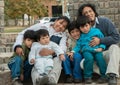 Latin family sitting in the street Royalty Free Stock Photo