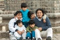 Latin family sitting in the street Royalty Free Stock Photo