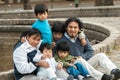 Latin family sitting in the street Royalty Free Stock Photo