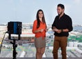 Latin female presenter and caucasian man at tv studio Royalty Free Stock Photo