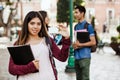 Latin Female student or international student in internship holding an ID card in Mexico City Royalty Free Stock Photo