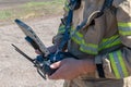 Latin firefighter piloting rescue drone Royalty Free Stock Photo