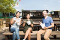 Latin friends eating takeout outdoors Royalty Free Stock Photo