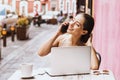 Latin girl, Young woman talking on the phone in coffee shop in Mexico Royalty Free Stock Photo