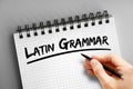 Latin grammar text on notepad, concept background