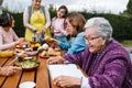 Latin grandmother and granddaughter, daughter cooking mexican food at home, three generations of women in Mexico Royalty Free Stock Photo