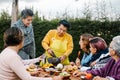 Latin grandmother and granddaughter, daughter cooking mexican food at home, three generations of women in Mexico Royalty Free Stock Photo