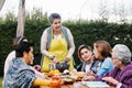 Latin grandmother and granddaughter, daughter cooking mexican food at home, three generations of women in Mexico Royalty Free Stock Photo