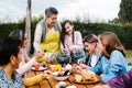 Latin grandmother and granddaughter, daughter cooking mexican food at home, three generations of women in Mexico Royalty Free Stock Photo