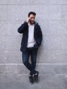 Latin handsome young man talking on the phone receiving bad news Royalty Free Stock Photo