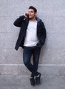 Latin handsome young man talking on the phone and smiling Royalty Free Stock Photo