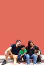 Latin, Hispanic family of mom, dad and children are sitting in the park they look happy enjoying quality time together in harmony Royalty Free Stock Photo