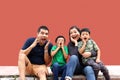 Latin, Hispanic family of mom, dad and children are sitting in the park they look happy enjoying quality time together in harmony Royalty Free Stock Photo