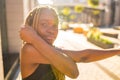 Latin hispanic girl with long yellow dreadlocks pigtails working out outdoor in ste streets in sity down town Royalty Free Stock Photo