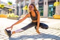 Latin hispanic girl with long yellow dreadlocks pigtails working out outdoor in ste streets in sity down town Royalty Free Stock Photo