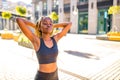 Latin hispanic girl with long yellow dreadlocks pigtails working out outdoor in ste streets in sity down town Royalty Free Stock Photo