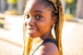 Latin hispanic girl with long yellow dreadlocks pigtails working out outdoor in ste streets in sity down town Royalty Free Stock Photo