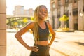 Latin hispanic girl with long yellow dreadlocks pigtails working out outdoor in ste streets in sity down town Royalty Free Stock Photo