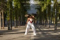 Latin and Hispanic girl, young and beautiful, dancing modern dance in the street outdoors. Dance concept, moonwalk, jumpstyle,