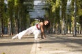 Latin and Hispanic girl, young and beautiful, dancing modern dance in the street outdoors. Dance concept, moonwalk, jumpstyle,