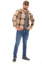 Latin man in flannel shirt cap and sunglasses Royalty Free Stock Photo
