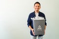 Latin man happy to be recycling plastic bottles Royalty Free Stock Photo