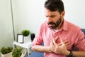 Latin man with suffering from a heart failure