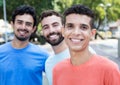 Latin man with two friends in the city Royalty Free Stock Photo