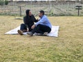 Latin man and woman couple in their 40s without children spends a day of rest having a picnic in a vineyard enjoying quality time